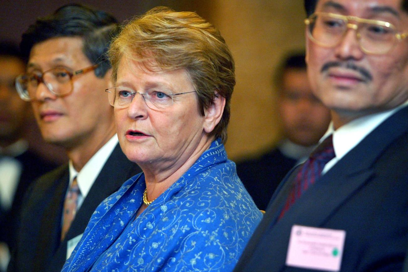 The photo shows the three health leaders at a table during a press conference.